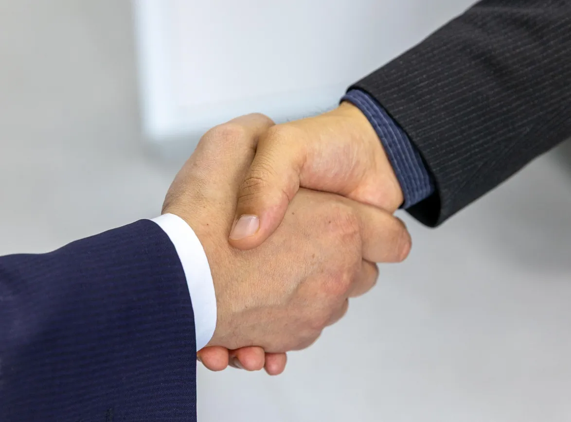 Close-up of two businessmen shaking hands