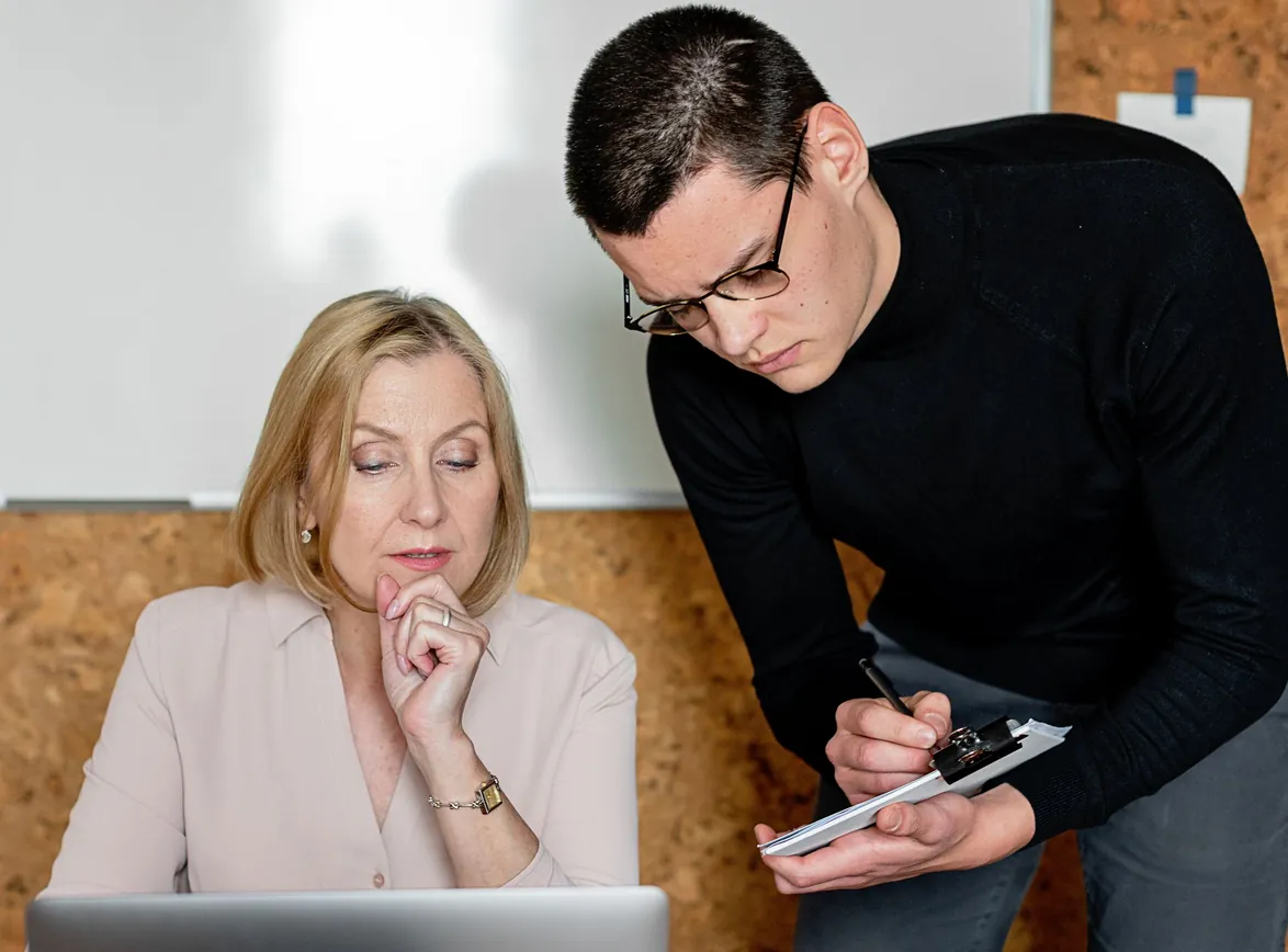 Two colleagues collaborating during a business meeting