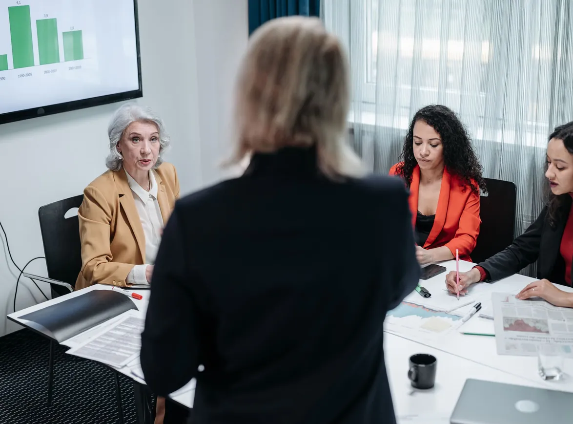 Team of professionals discussing strategy in a modern office setting during a business meeting
