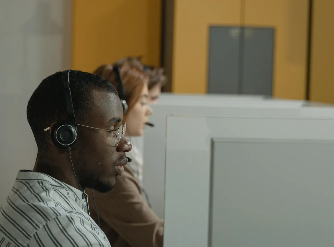 Professional call center agents working in a modern office environment