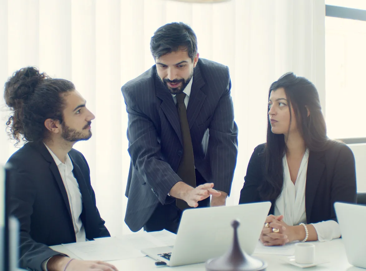 Professional team in office discussing a business project with focused collaboration