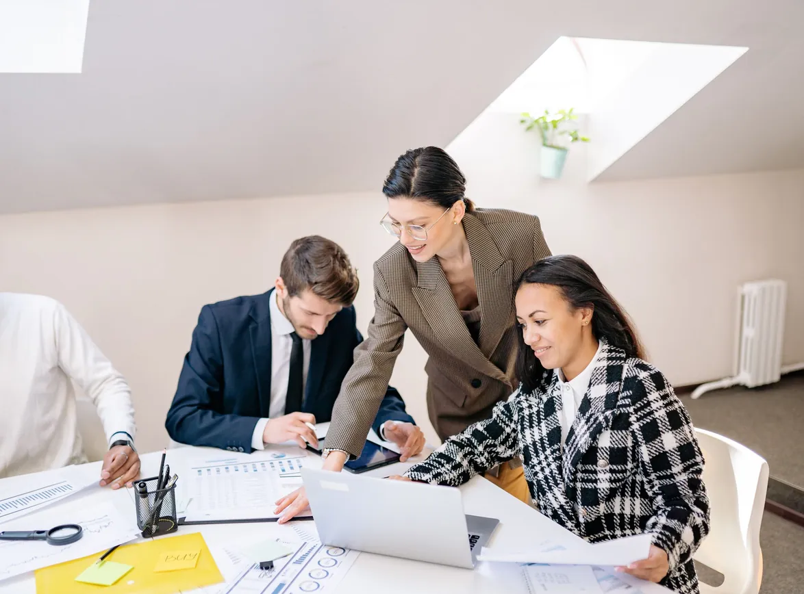 Colleagues collaborating in a modern office during a daytime meeting